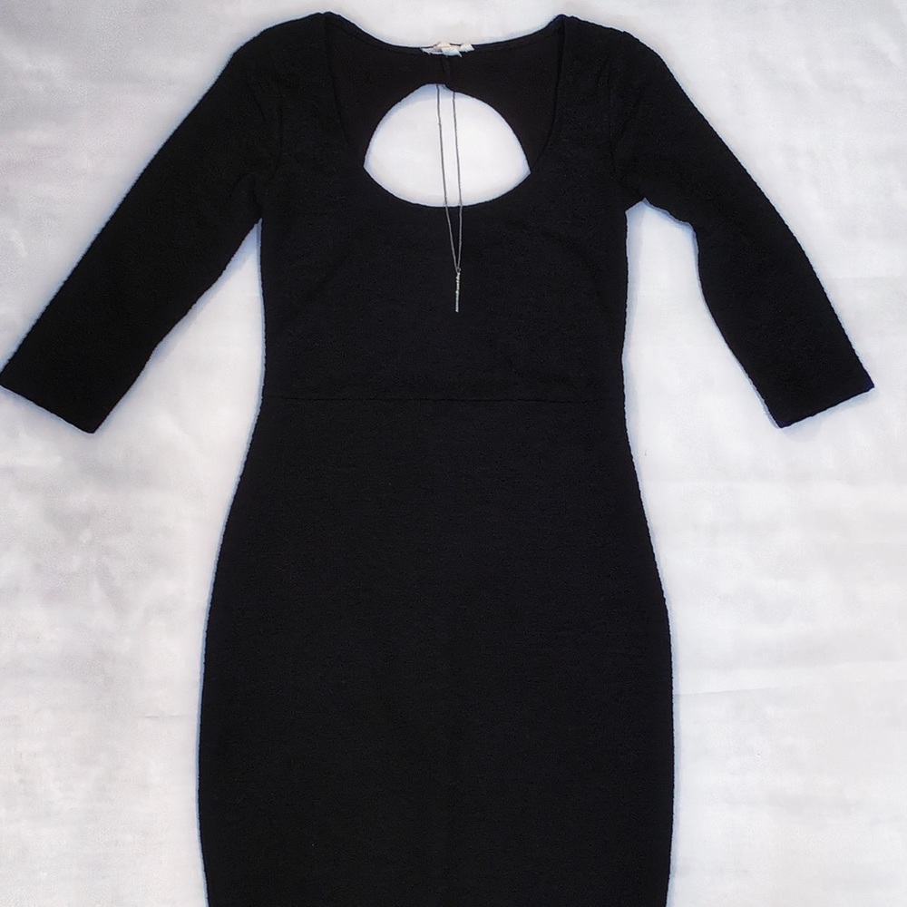 Straight fitted black dress.